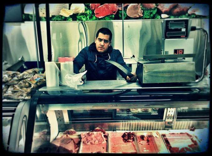 Ed Calderon behind a butcher's counter